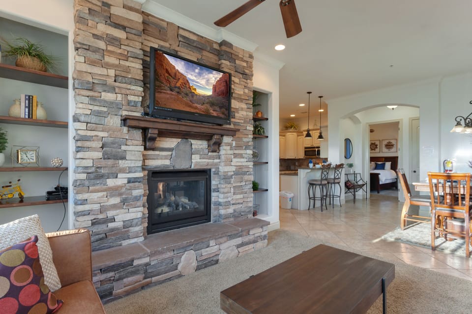 Living room, dining room, and kitchen, looking towards entrance to masters suite.