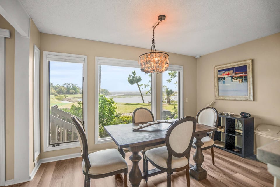 Dining area with a unique oyster shell chandelier