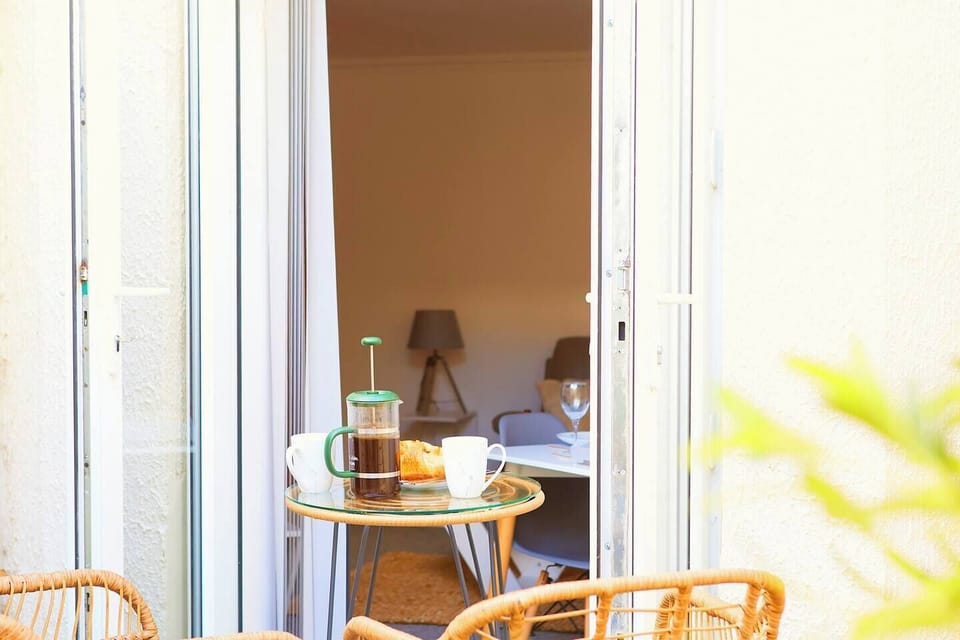  Double patio door to outside seating and courtyard.An inviting outdoor oasis, perfect for relaxation and conversation.