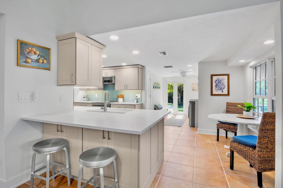 Stylish island with barstools