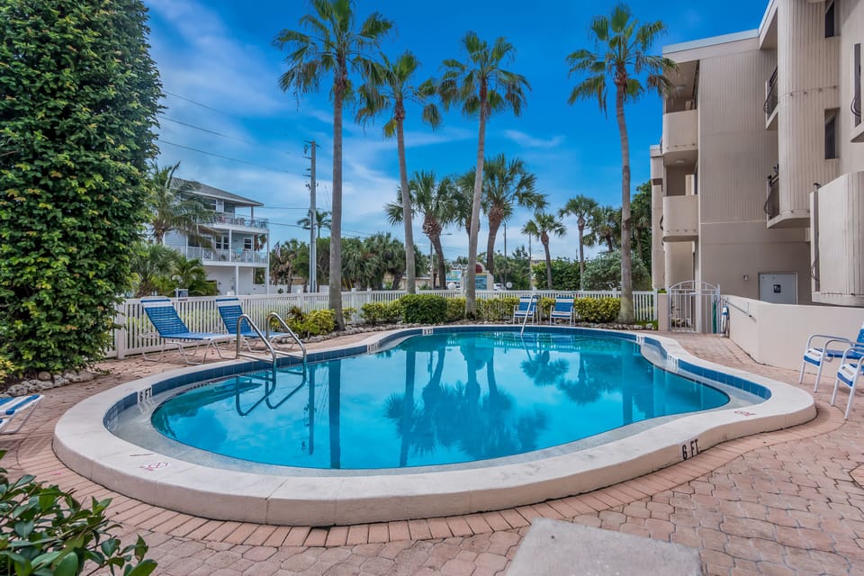 Community Pool with Lounge Chairs