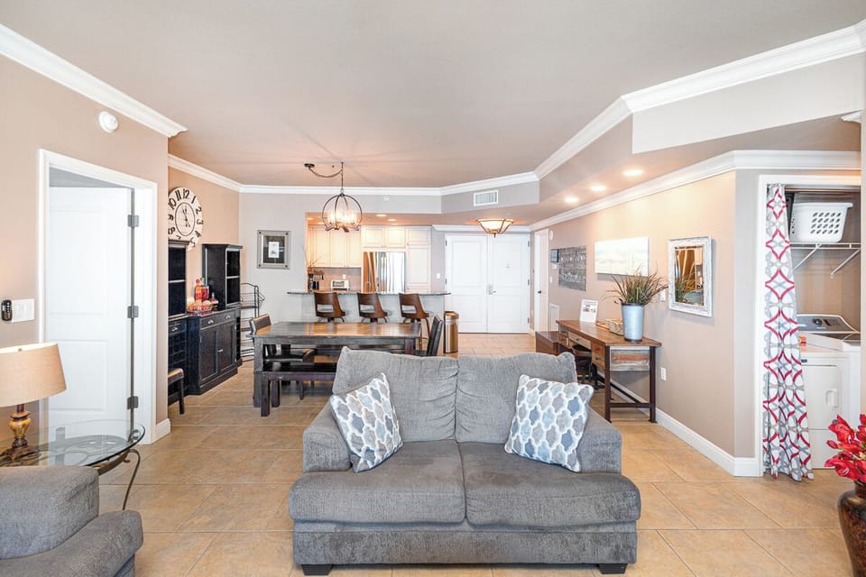 Your spacious open-concept living area flows seamlessly from relaxation to dining and kitchen, offering plenty of room to spread out and feel right at home.
