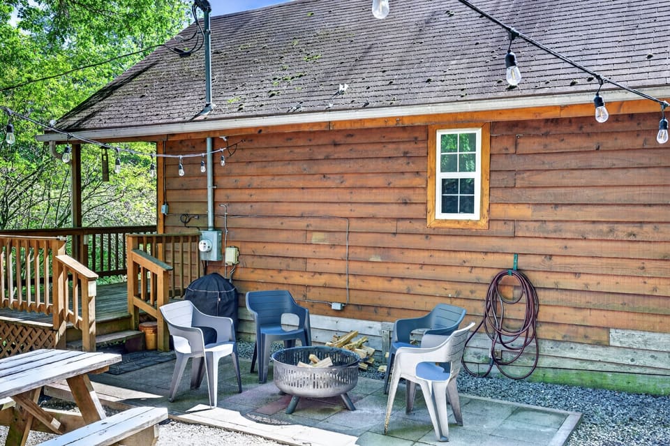 Unwind around the fire pit beneath the string lights after a day of adventure.
