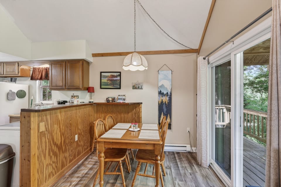 Share meals together in the dining area with easy access to the covered porch.