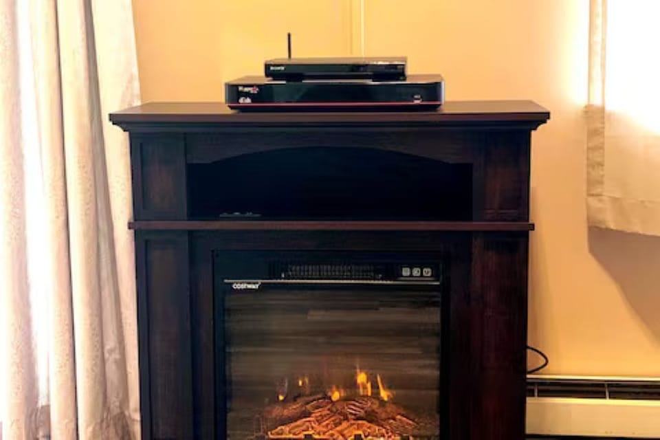 Cozy up by the electric fireplace after a day exploring the Shenandoah Valley.