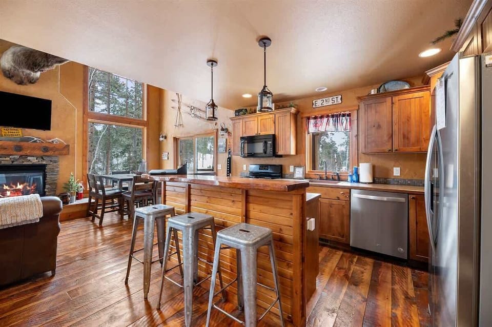 Main level fully equipped kitchen and breakfast bar with seating for 3