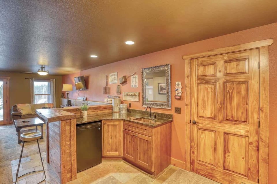 Wet bar with sink and mini fridge