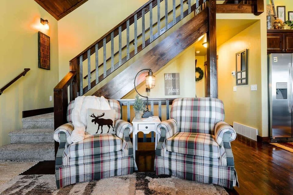 Main floor with staircase to upstairs loft.
