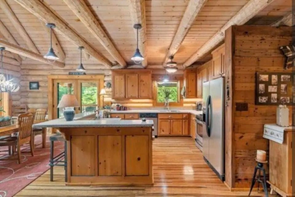 Cook up a feast in the open kitchen with a bar island, seating, and modern appliances.