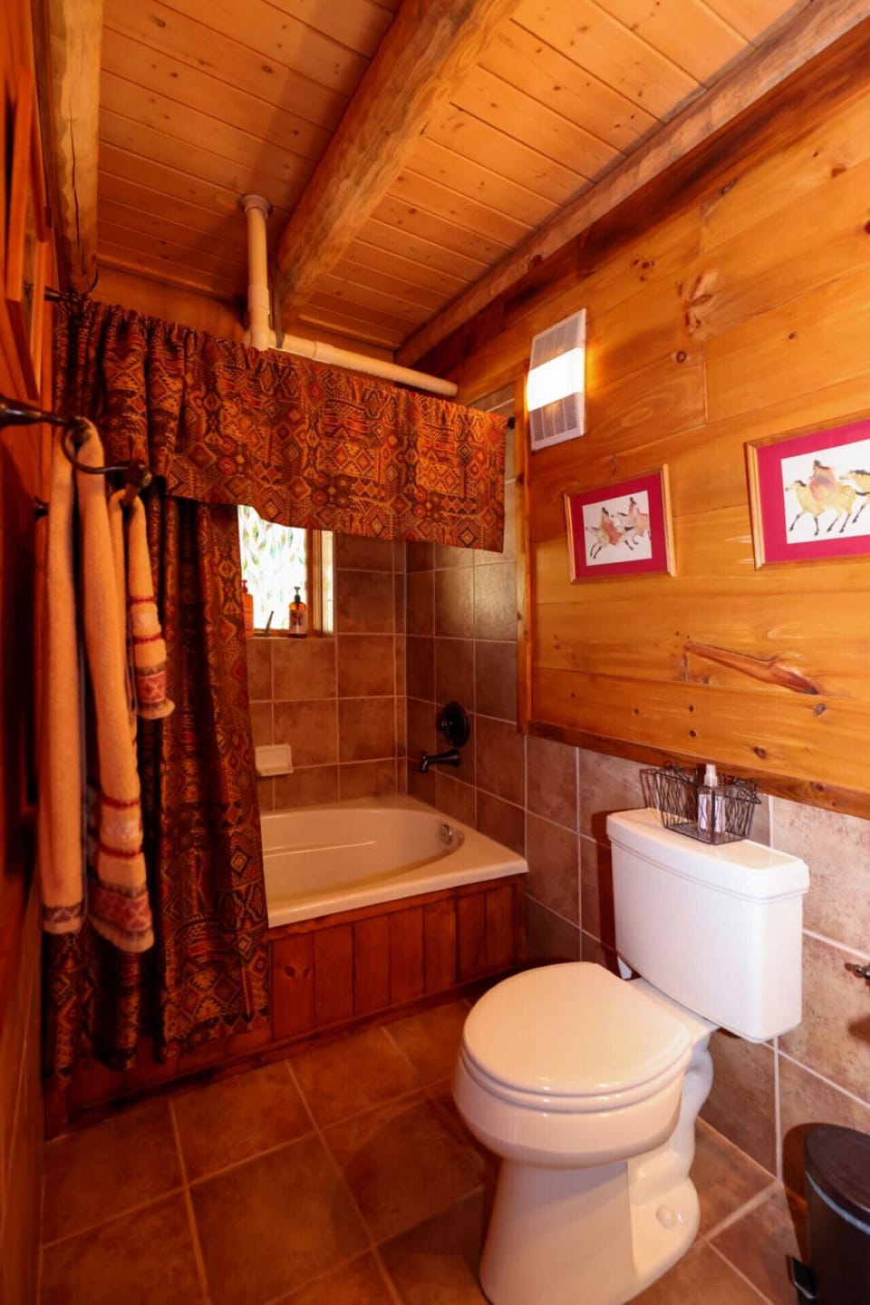 Convenient first-floor ensuite bathroom with shower/tub combo, accessible from the hallway and laundry room.