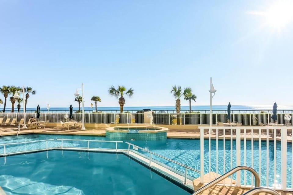 Majestic Sun has a large pool, two hot tubs on the elevated, and spacious patio with plenty of seating and shade overlooking the shimmering Gulf of Mexico.