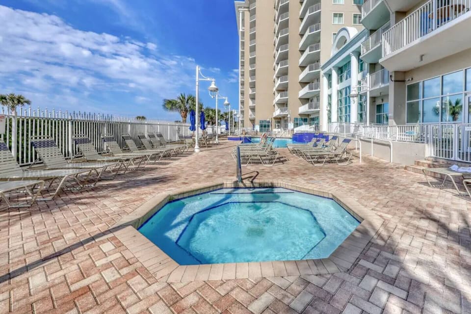 Majestic Sun has a large pool, two hot tubs on the elevated, spacious patio overlooking the Gulf