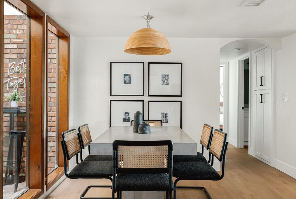 Dine in style in our modern dining area with a beautiful view of the outdoor space.
