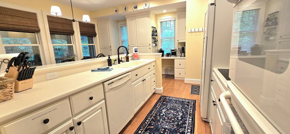 Well furnished kitchen features double wall ovens, plus a coffee bar,