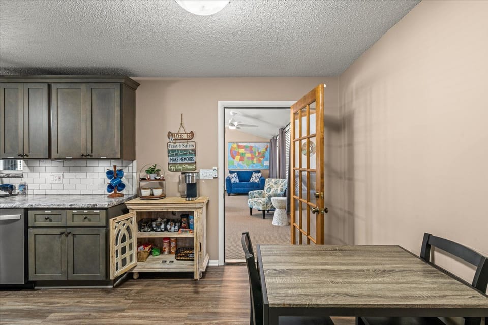 Kitchen view looking towards coffee bar and sunroom.