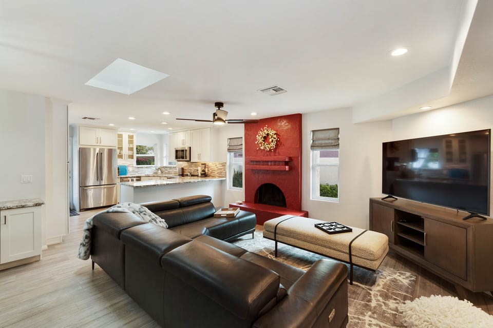 Open kitchen design flows seamlessly into the family room.