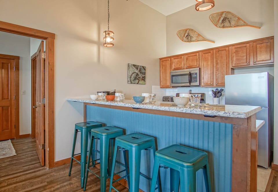 The kitchen bar has seating for 4.