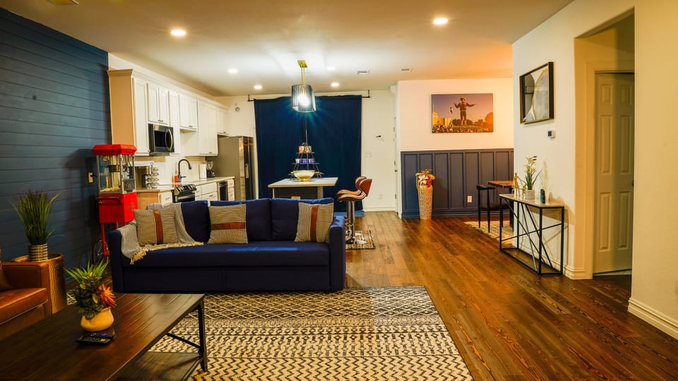 AS you enter the home, you are greeted by the welcoming living room.