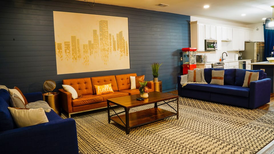 Spacious living room has three couches, perfect for the whole family to sit on! 