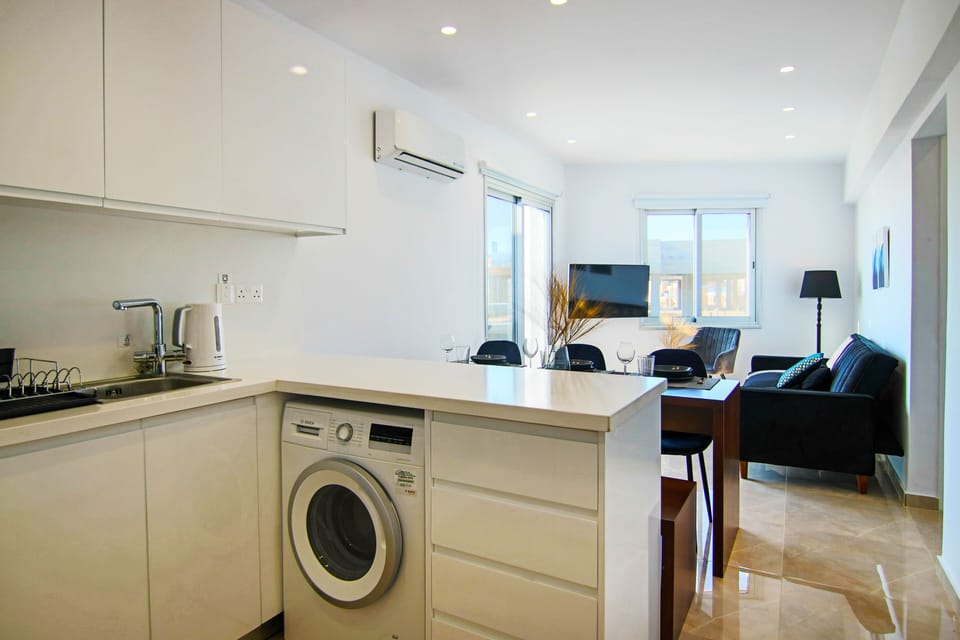 Deluxe Apartment | Private kitchen | Fridge
