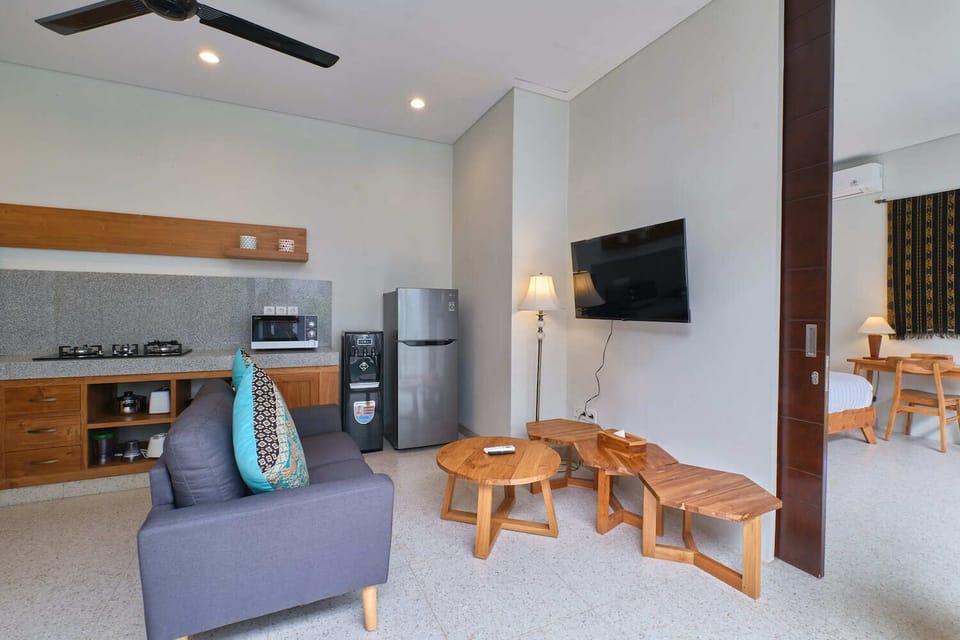 Deluxe Villa | Living area | 50-inch flat-screen TV with digital channels