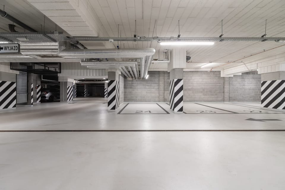 Spacious underground parking area with well-marked bays, secure access, and modern lighting for added convenience and safety.