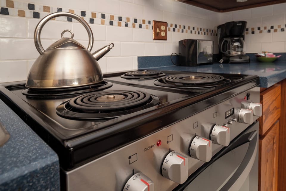 Your fully equipped kitchen features an electric stove perfect for preparing home-cooked meals during your stay.