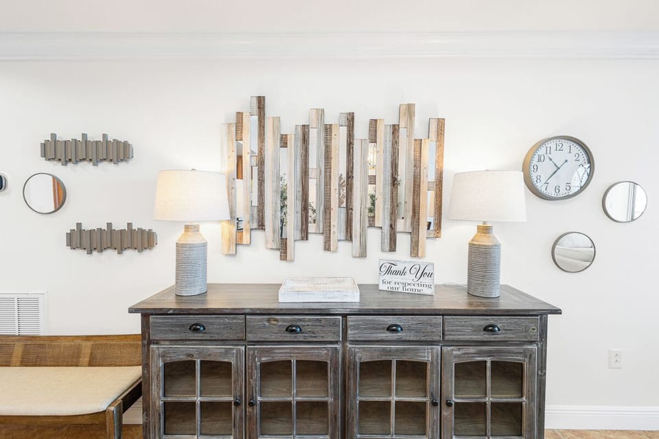 Rustic yet refined, this thoughtfully designed space features reclaimed wood accents, nautical-inspired decor, and vintage-style furnishings that create a cozy, welcoming atmosphere you'll love settling into.