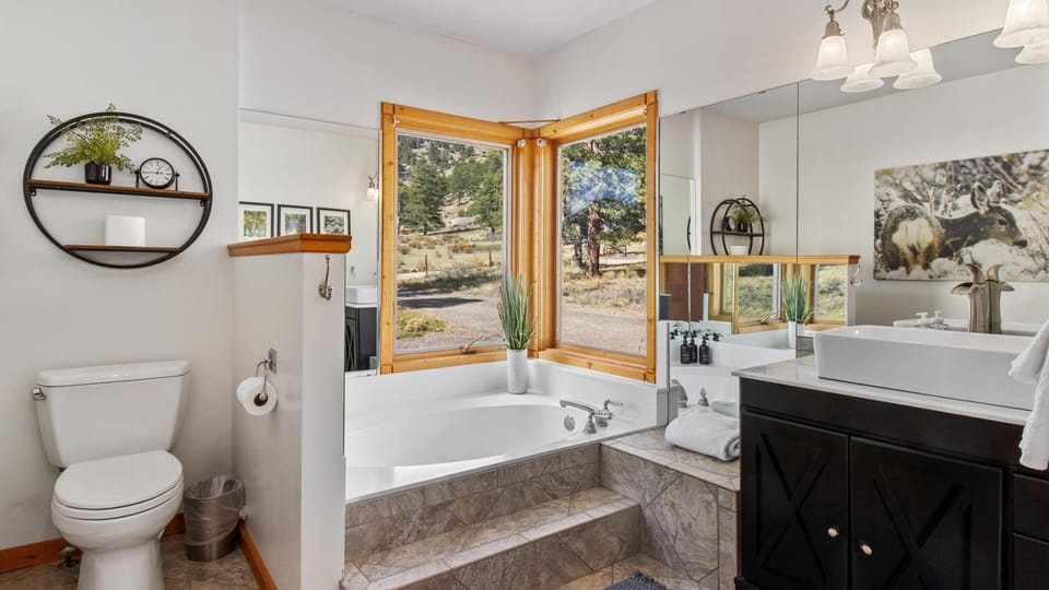 Spa-like bathroom retreat with soaking tub and natural light