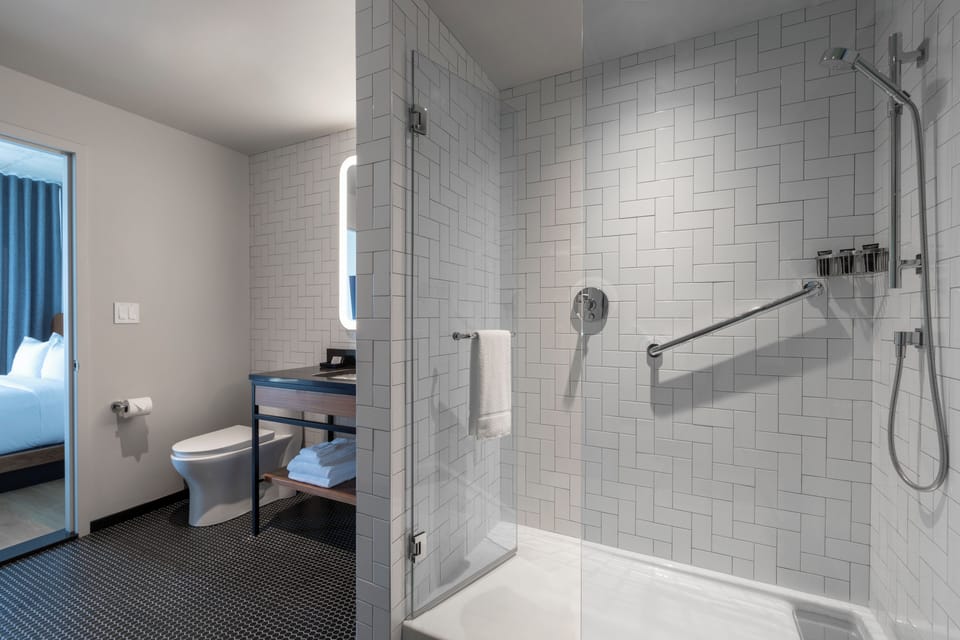 Suite, 1 King Bed | Bathroom | Shower, rainfall showerhead, eco-friendly toiletries, hair dryer