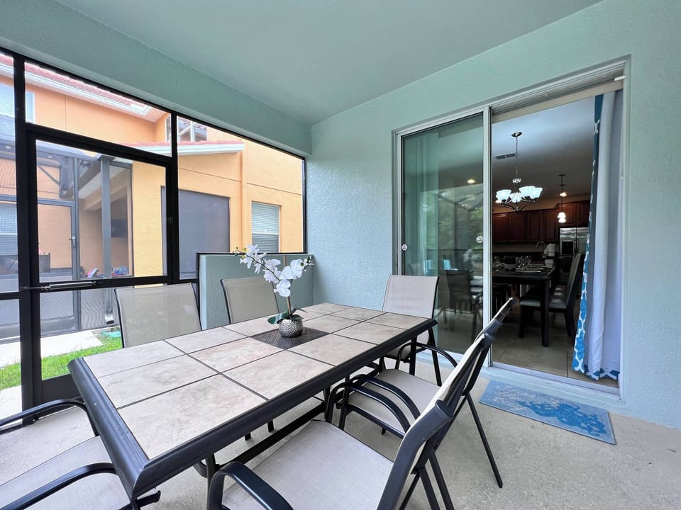 Seating area in private screened in pool patio