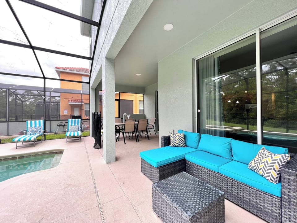 Seating area in private screened in pool patio