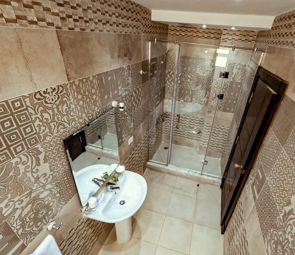 Shower, rainfall showerhead, eco-friendly toiletries, slippers
