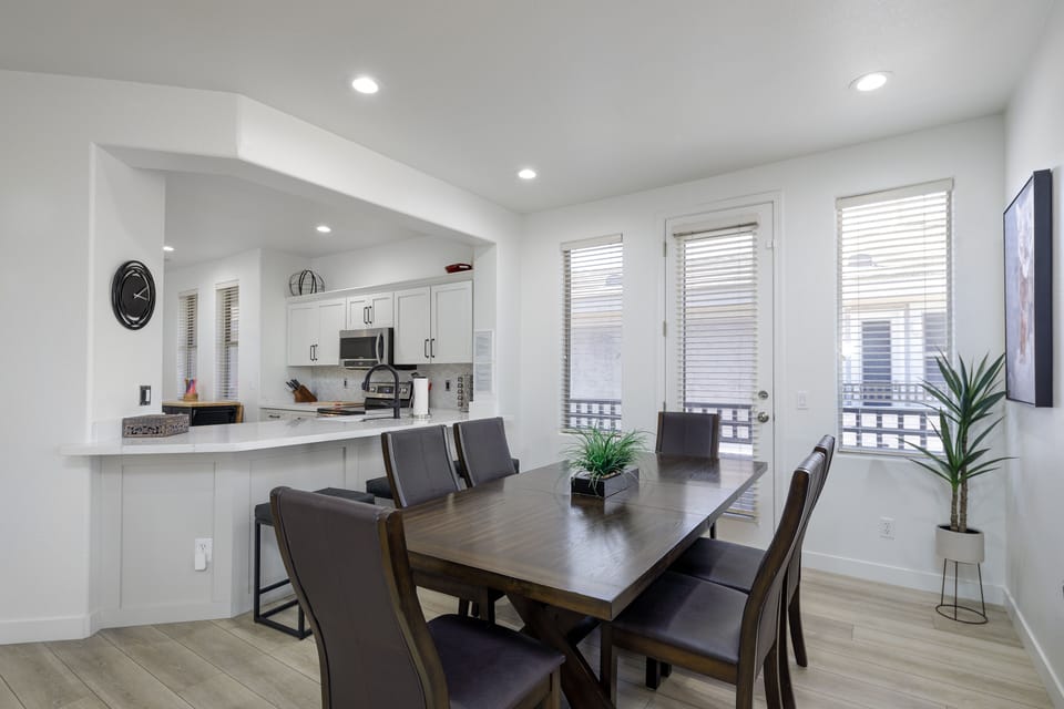 Formal dining area with extra seating at the kitchen bar.