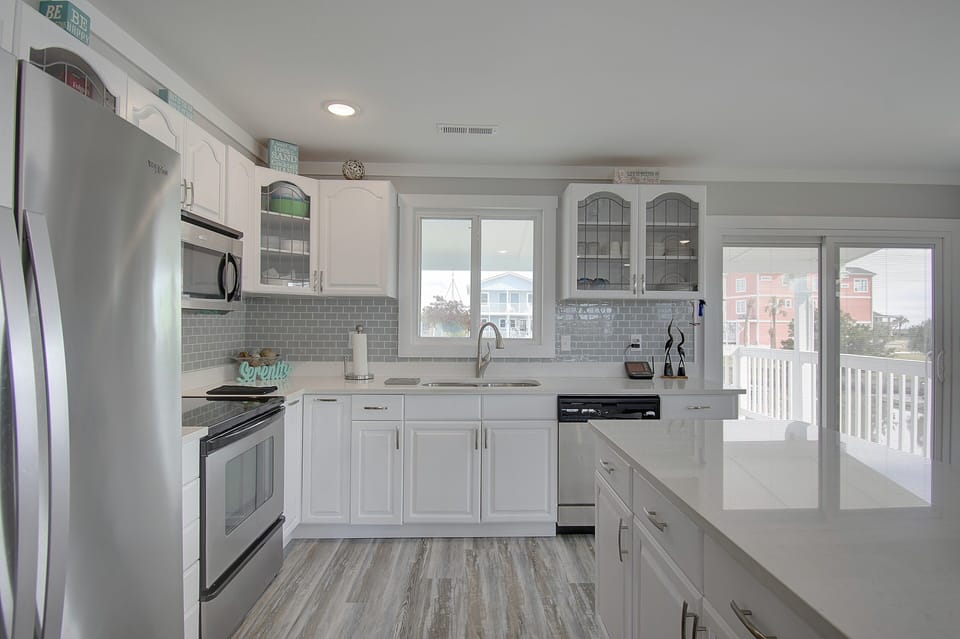 Large well appointed kitchen with stainless steel appliances