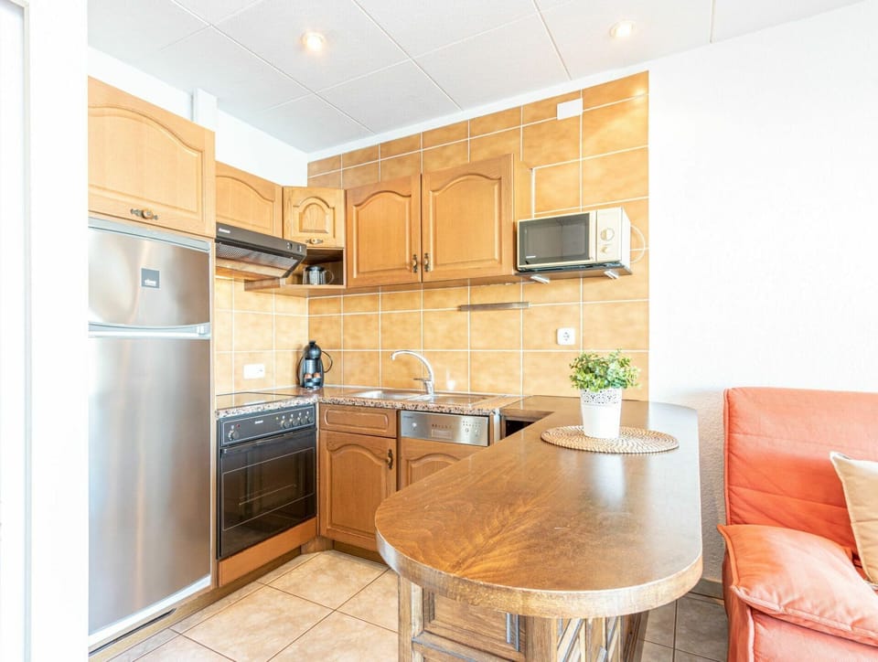 Furniture, Cabinetry, Property, Building, Countertop, Table, Kitchen Stove, Wood, Chair, Interior Design