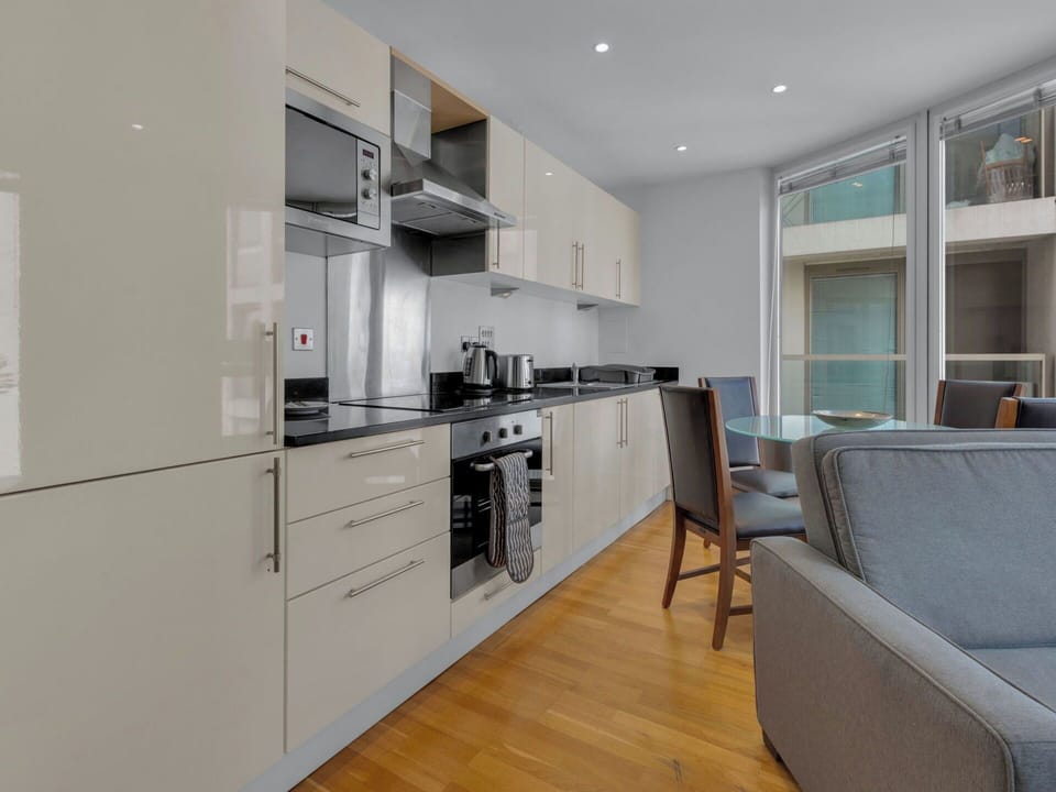 Interior Design, Flooring, Furniture, Floor, Cabinetry, Wood, Room, Ceiling, Countertop, Kitchen