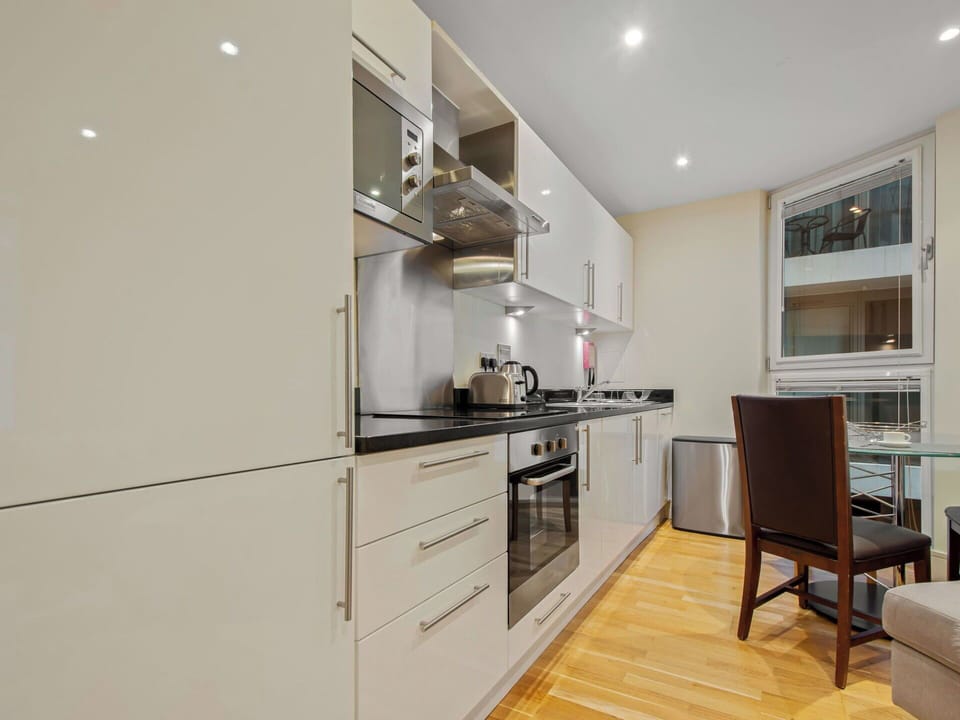 Flooring, Interior Design, Countertop, Wood, Floor, Kitchen, Kitchen Appliance, Furniture, Cabinetry, Ceiling