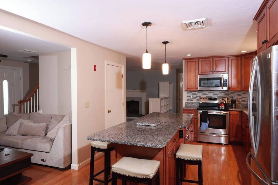 View showing part of the kitchen and connects you to both living room and dinning section