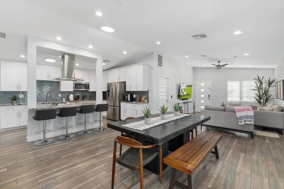 Open-concept kitchen and dining area, seamlessly fronting the spacious living area for a perfect flow of space.