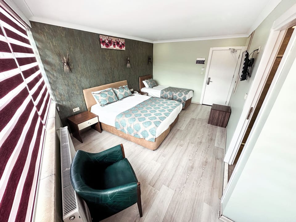 Family Triple Room | Hypo-allergenic bedding, minibar, in-room safe, desk