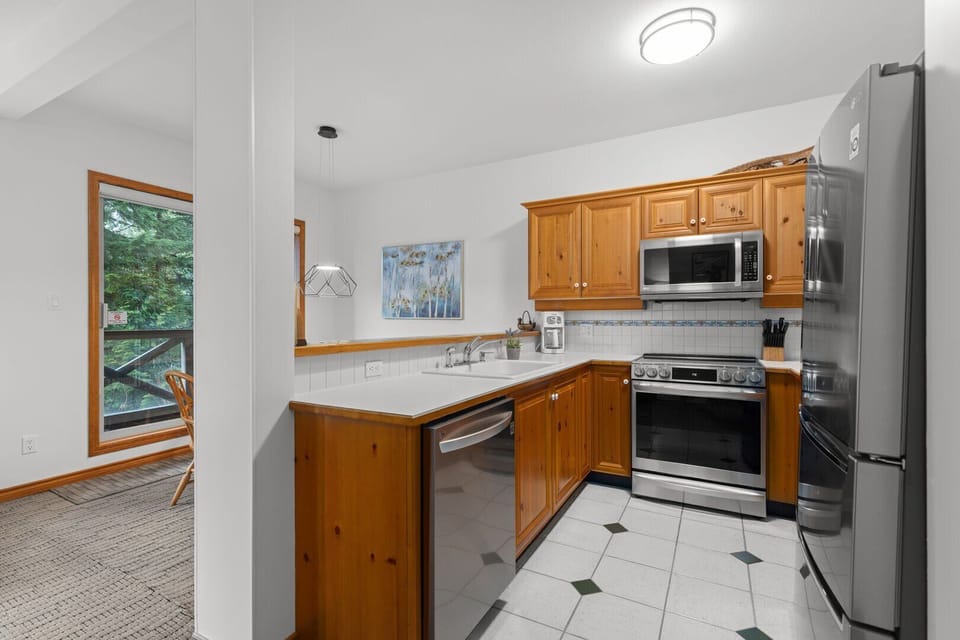 Large kitchen in original style, with modern appliances