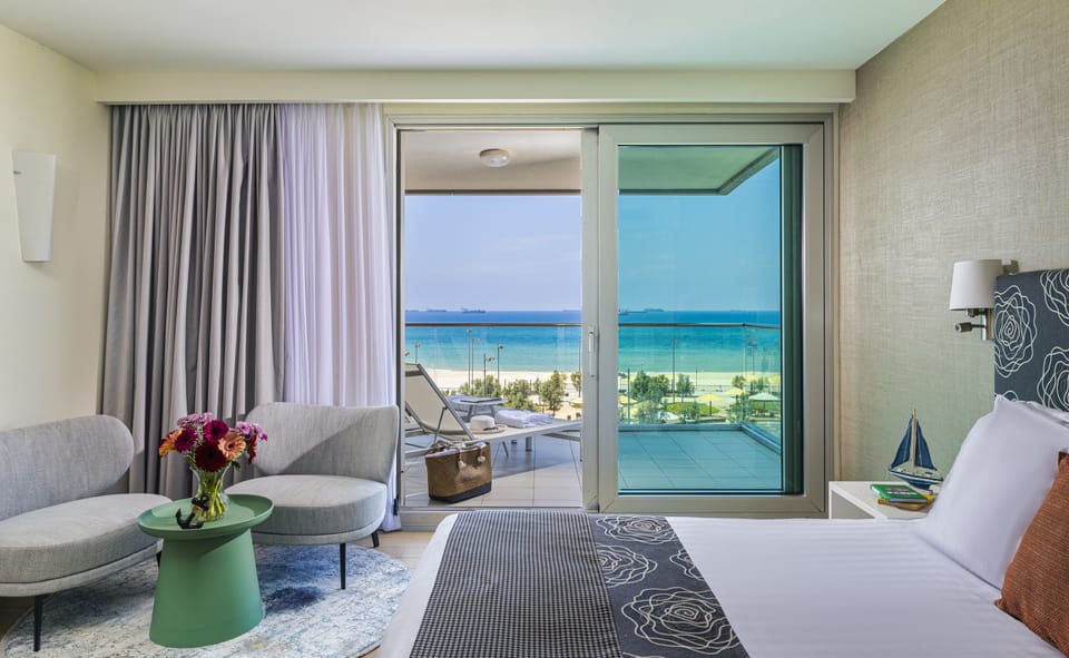 Deluxe Room, Balcony, Sea View | 1 bedroom, minibar, in-room safe, free WiFi