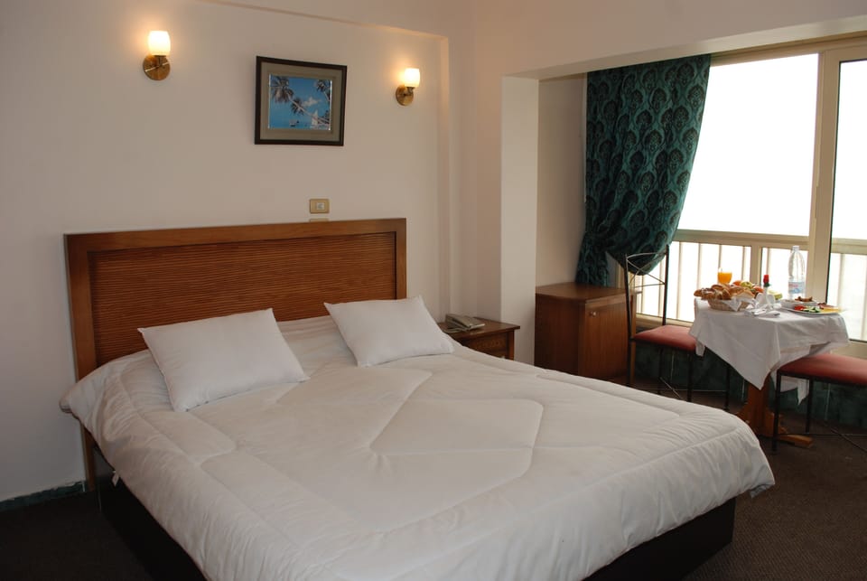 Deluxe Double Room, Beach View | Minibar, desk, soundproofing, free WiFi