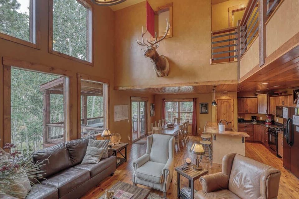 Main floor living room with large windows 