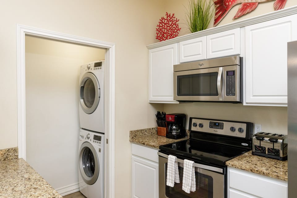 Your fully equipped kitchen features granite countertops, stainless appliances, and convenient in-unit laundry for ultimate comfort.