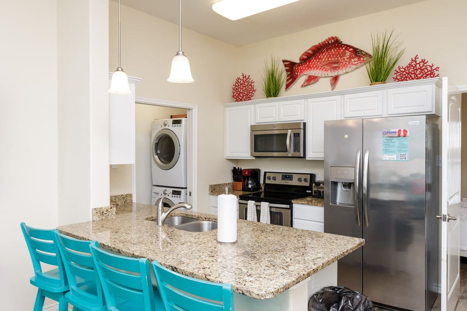Your fully-equipped kitchen invites culinary adventures with granite counters, stainless appliances, and convenient in-unit laundry.