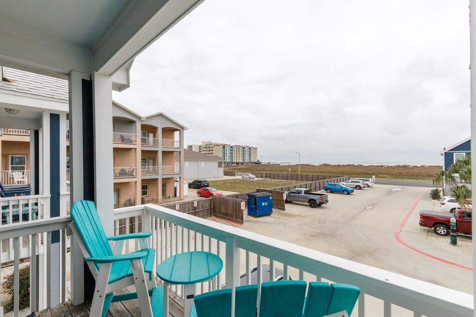 Relax in your bright turquoise chairs while enjoying the open view from your private balcony overlooking the peaceful surroundings.