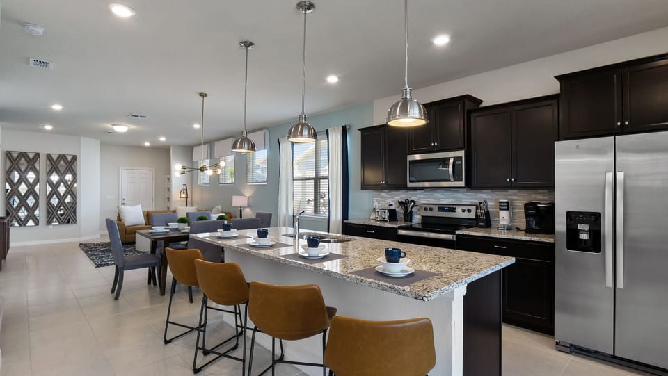 Modern kitchen with bar-stool seating for 4
