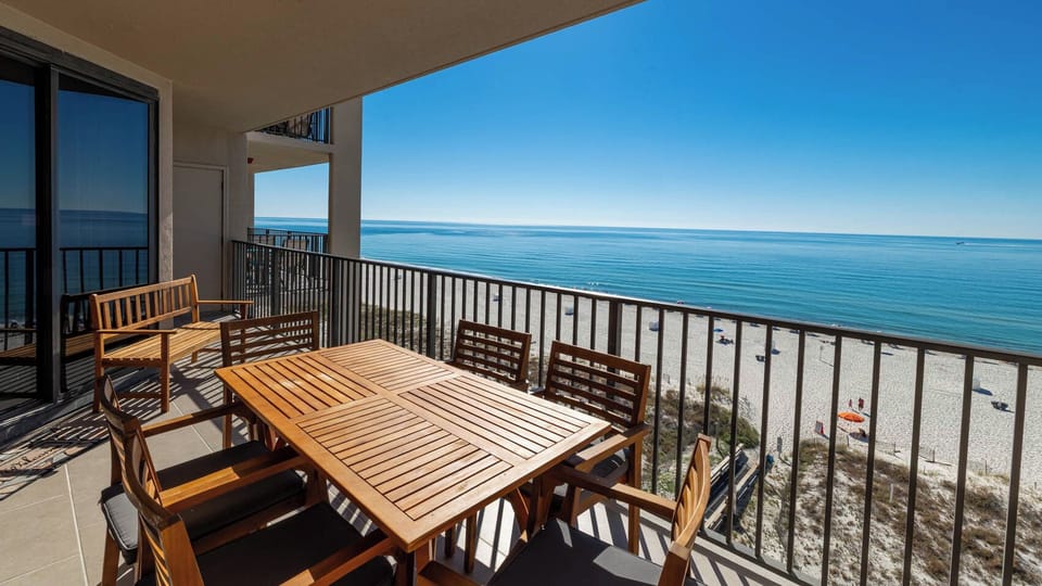 Enjoy meals or drinks at the outdoor table while taking in the tranquil views of the water and beach below